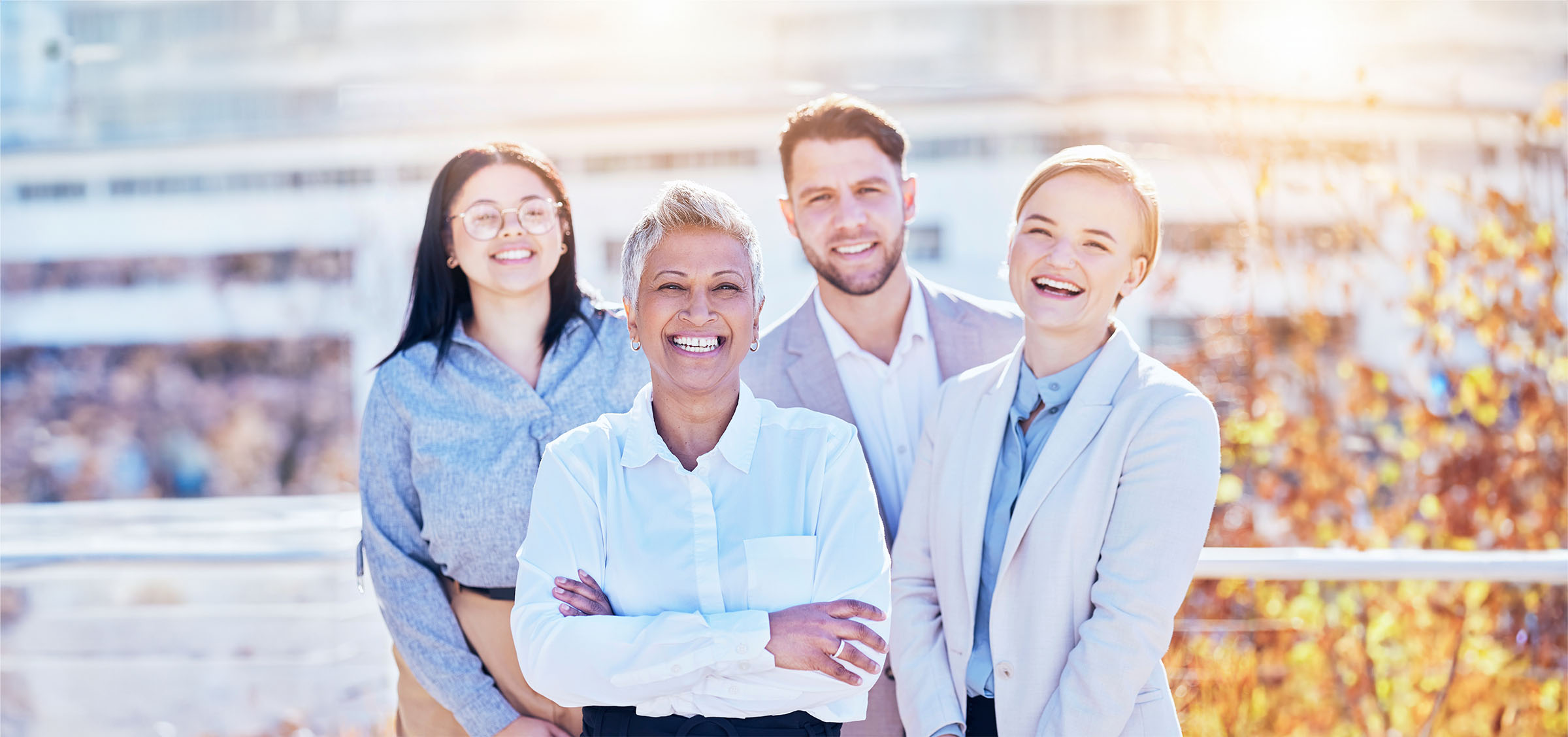 Smile, portrait of business people and team building outside office with happy employees at creativ.