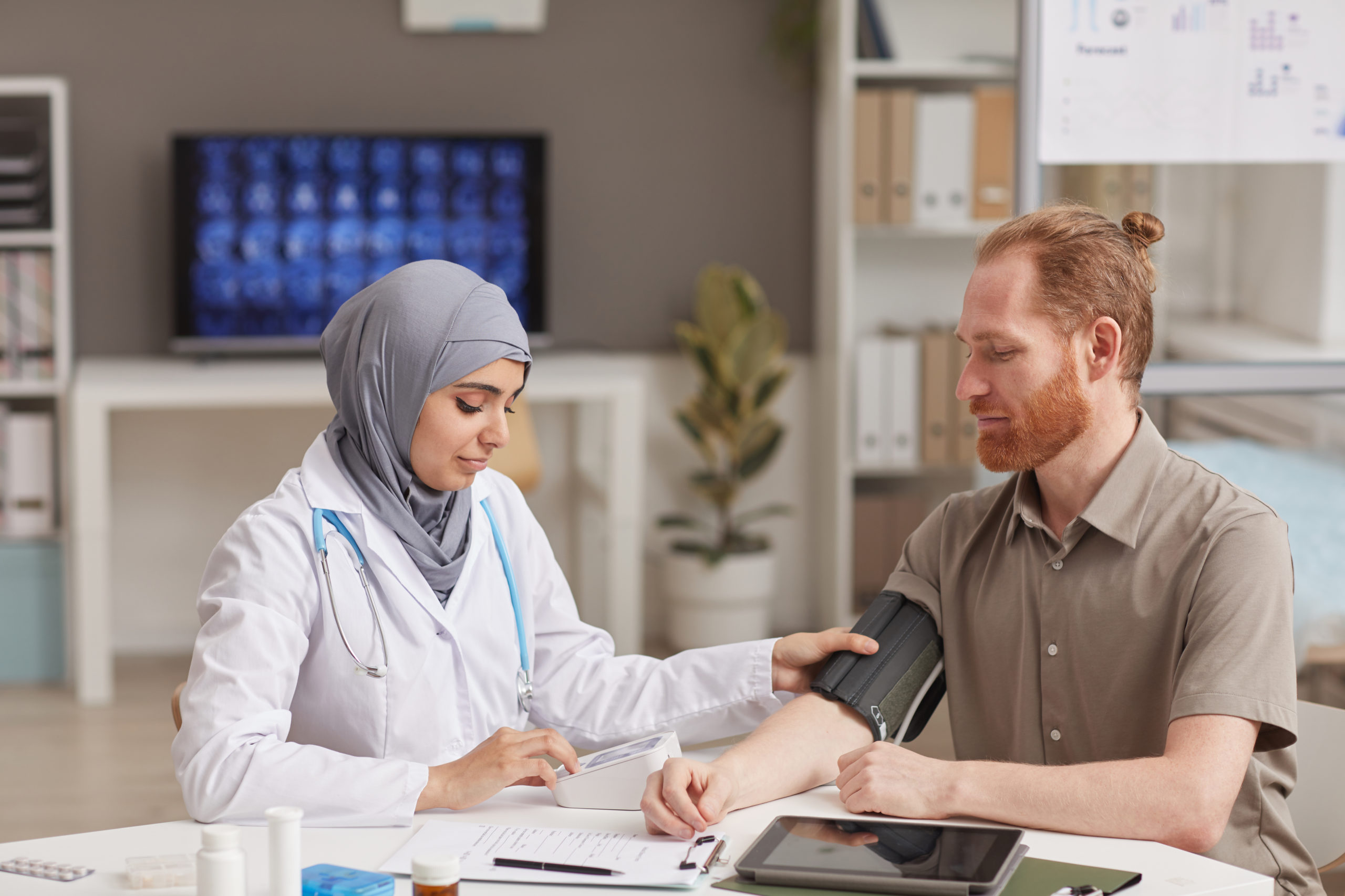 Doctor measuring the pressure